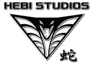 HEBI Studios logo. Black and white outline of a cobra head with text at the top stating the company name, and kanji in the bottom right corner.